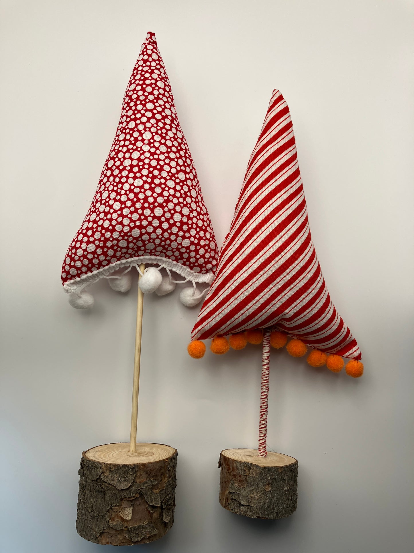 Red and white striped tree with orange pompoms