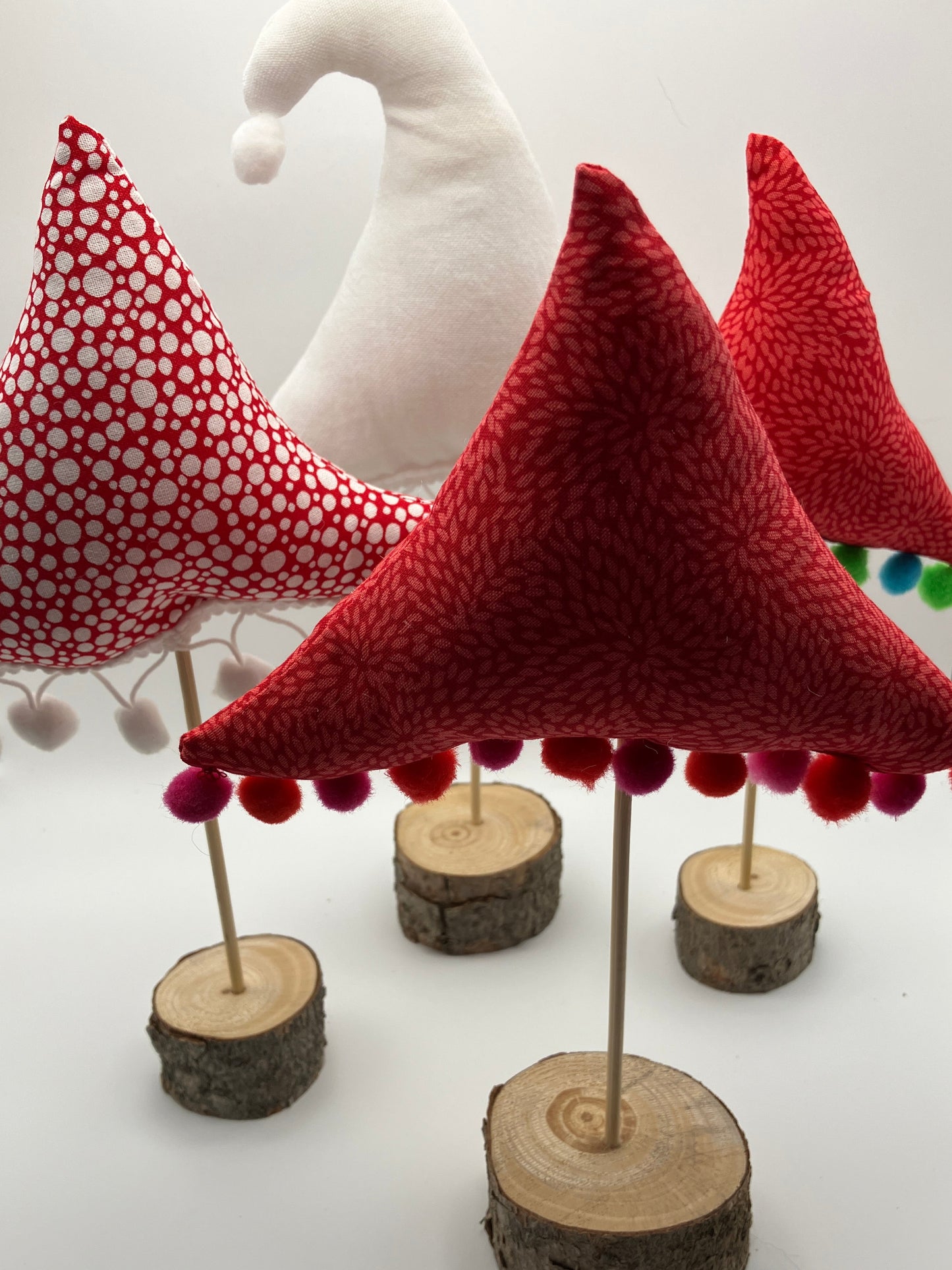 Red pattern fabric tree with pink and red pompoms.