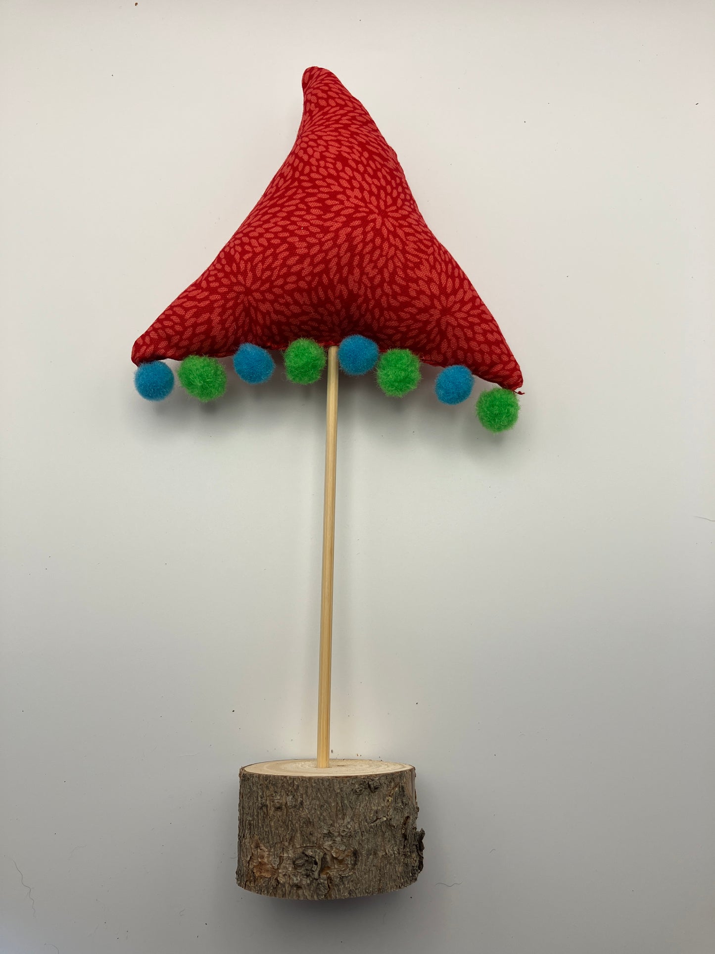 Red Christmas tree with blue and green pompoms!