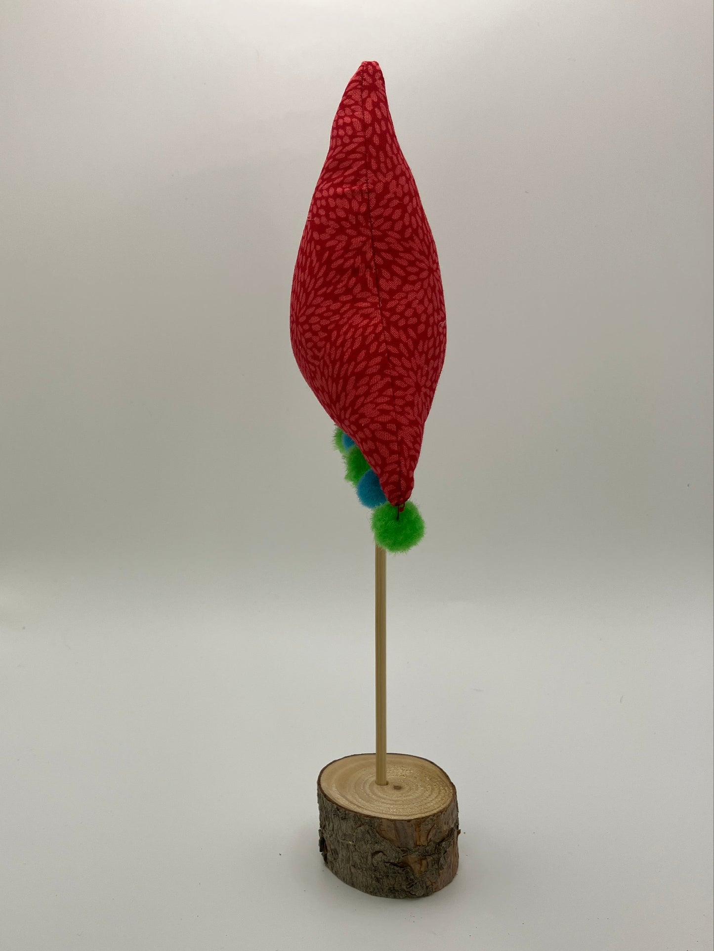 Red Christmas tree with blue and green pompoms!