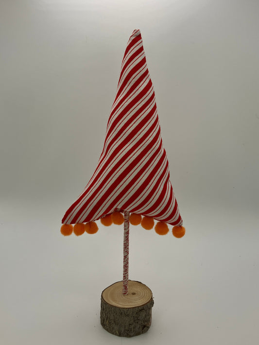 Red and white striped tree with orange pompoms